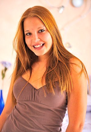 Brown-haired babe showing her cute face while picking toys for solo action