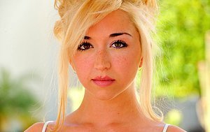 Boundlessly appealing blonde in a funny dress strips naked in public