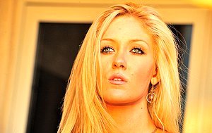 Slim blonde with a perfect body shows off her physique on camera